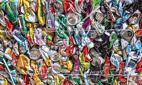 multi-coloured aluminium cans crushed into a block